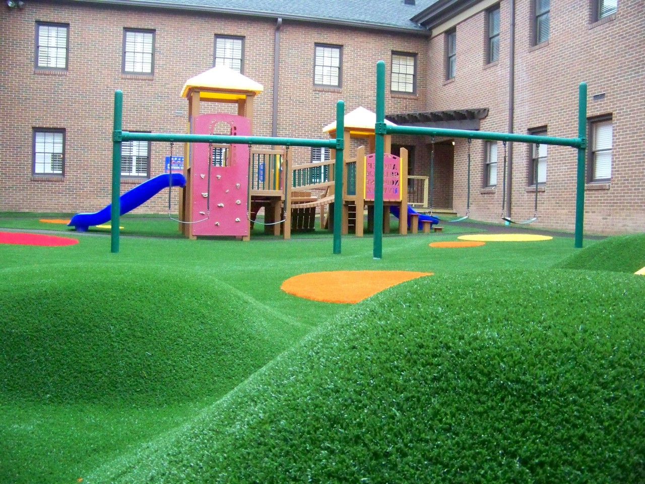 Hilly artificial turf playground by Southwest Greens of Illinois
